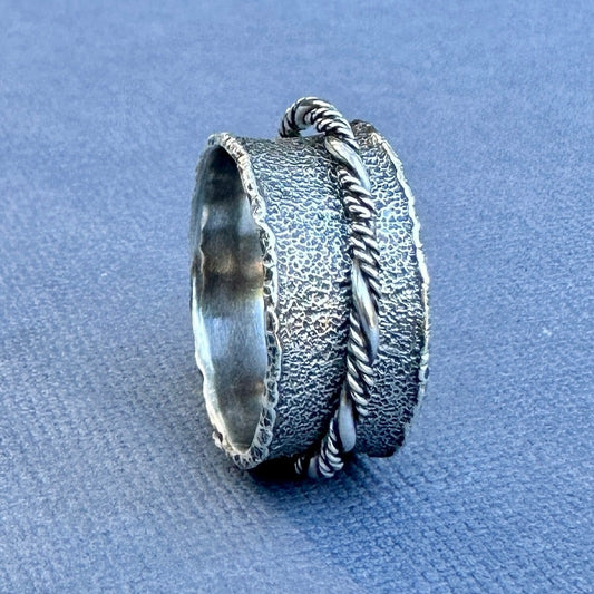 Wide silver spinner ring, size 10, by Leslie Scholz of Green Bird Studio. 