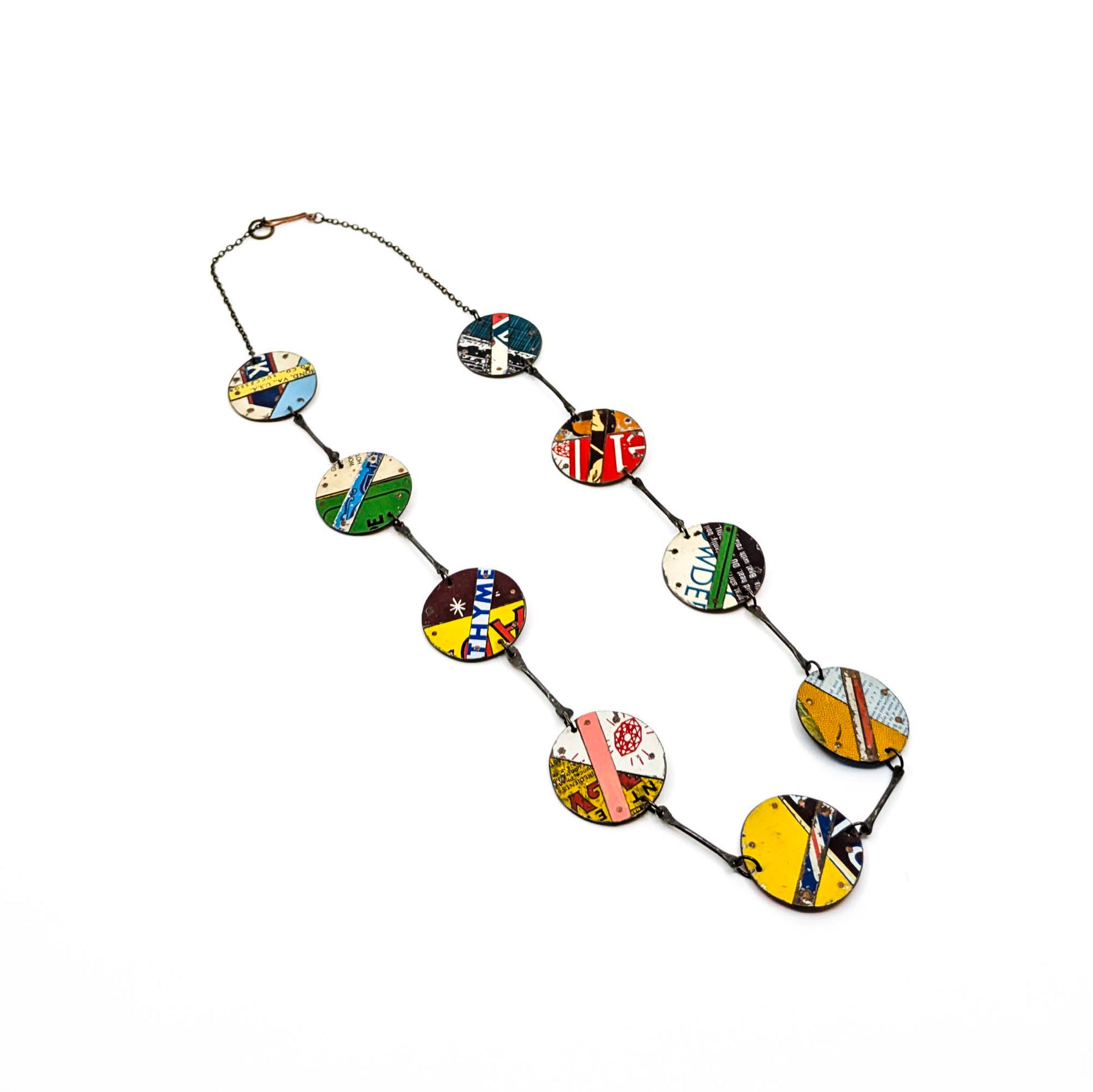 Necklace with colorful circular pendants on a white background