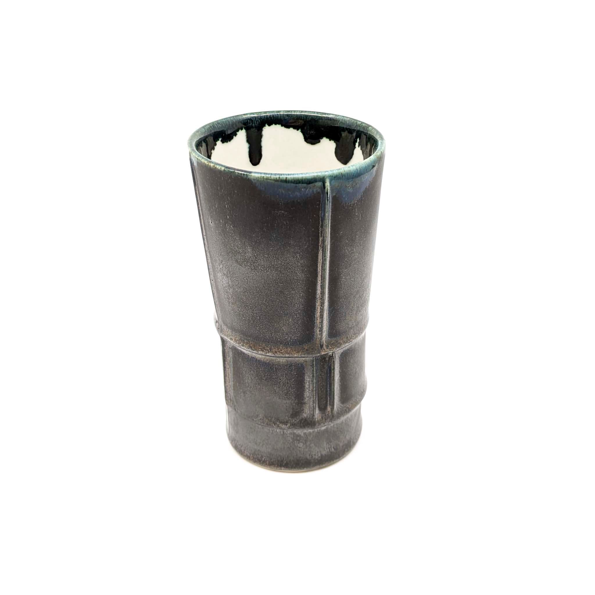 Black ceramic tumbler on a white background
